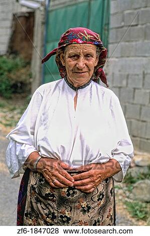 Woman in colorful clothes in Albania near Tirana View Large Photo Image Stock Photo - Woman in colorful clothes in Albania near Tirana. Fotosearch