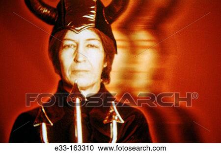 Woman in devil costume View Large Photo Image Stock Image - Woman in devil costume. Fotosearch