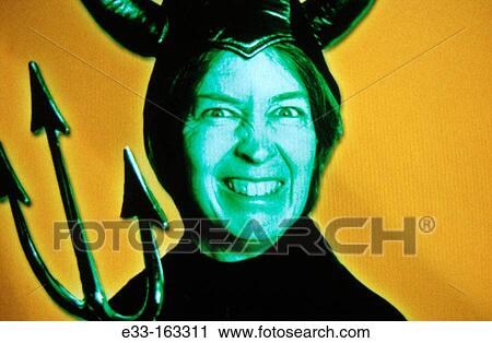 Woman in devil costume View Large Photo Image Stock Image - Woman in devil costume. Fotosearch