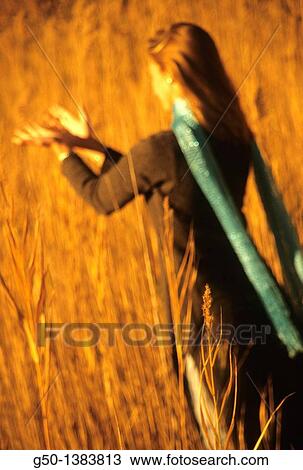 Stock Image - Woman in Dune Grass. Fotosearch