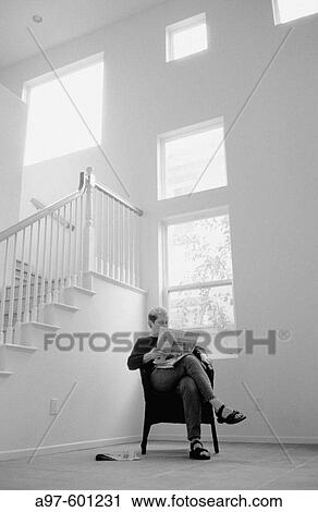 Woman in empty room View Large Photo Image Stock Image - Woman in empty room. Fotosearch