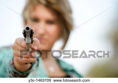 Woman in fear pointing gun View Large Photo Image Stock Photo - Woman in fear pointing gun. Fotosearch