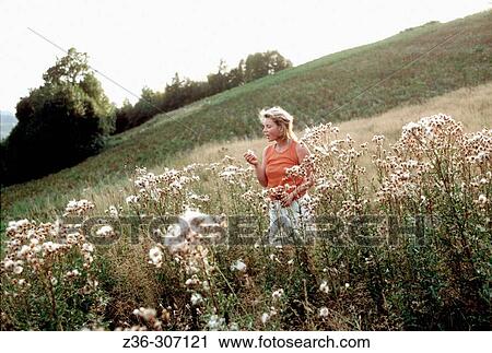 Stock Image - Woman in field. Fotosearch