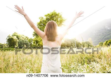 Woman in field View Large Photo Image Stock Photograph - Woman in field. Fotosearch