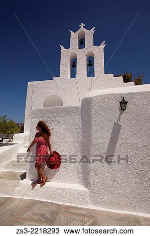 Woman in front of a church, the Byzantine church of Agia Irini near the Ormos harbour, Ios, Cyclades Islands, Greek Islands, Greece, Europe. View Large Photo Image Stock Image - Woman in front of a church, the Byzantine church of Agia Irini near the Ormos harbour, Ios, Cyclades Islands, Greek Islands, Greece, Europe.. Fotosearch