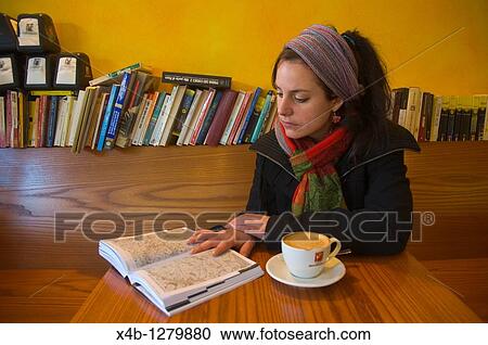 Woman in her 20s reading guidebook and drinking cappuccijno in Santa Croce district Venice the Veneto northern Italy Europe View Large Photo Image Stock Image - Woman in her 20s reading guidebook and drinking cappuccijno in Santa Croce district Venice the Veneto northern Italy Europe. Fotosearch
