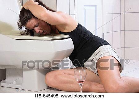 Woman in her 30's having a hang over throwing up on a toilet View Large Photo Image Stock Photography - Woman in her 30's having a hang over throwing up on a toilet. Fotosearch