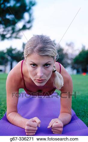 Woman in her mid 20's doing yoga in the park. Santa Monica. California. USA. View Large Photo Image Stock Image - Woman in her mid 20's doing yoga in the park. Santa Monica. California. USA.. Fotosearch