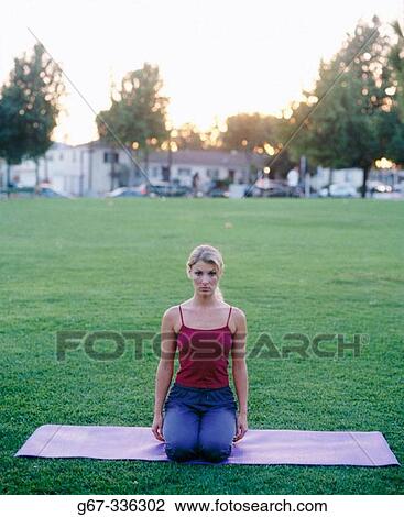 Woman in her mid 20's doing yoga in the park. Santa Monica. California. USA. View Large Photo Image Stock Image - Woman in her mid 20's doing yoga in the park. Santa Monica. California. USA.. Fotosearch