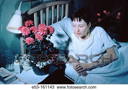 Woman in hospital bed after labor View Large Photo Image Stock Image - Woman in hospital bed after labor. Fotosearch