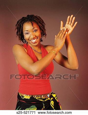 Woman in Jamaican apparel, dreadlocks hair style View Large Photo Image Stock Image - Woman in Jamaican apparel, dreadlocks hair style. Fotosearch