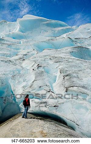 Woman in Jostedalsbreen glacier (Nigardsbreen). Sogn og Fjordane. Norway. View Large Photo Image Stock Image - Woman in Jostedalsbreen glacier (Nigardsbreen). Sogn og Fjordane. Norway.. Fotosearch