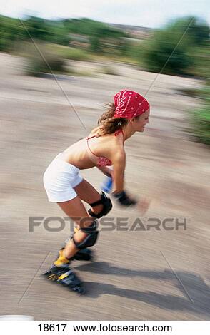 Stock Photo - Woman in-line skating. Fotosearch