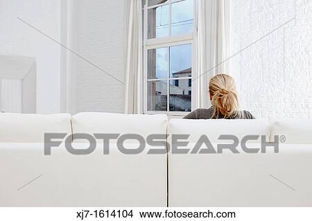 Woman in living room View Large Photo Image Picture - Woman in living room. Fotosearch