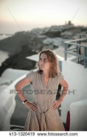 Woman in Oia Santorini Cyclades Islands Greece View Large Photo Image Stock Photo - Woman in Oia Santorini Cyclades Islands Greece. Fotosearch