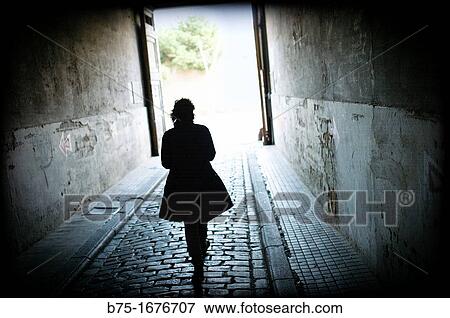 Woman in passageway View Large Photo Image Stock Photo - Woman in passageway. Fotosearch