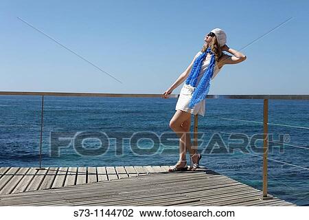 Stock Image - Woman in Praia de Vale de Centeanes, Carvoeiro, Lagoa, Algarve, Portugal. Fotosearch