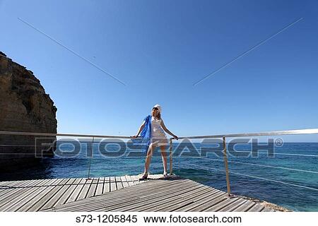 Woman in Praia de Vale de Centeanes, Carvoeiro, Lagoa, Algarve, Portugal View Large Photo Image Stock Photography - Woman in Praia de Vale de Centeanes, Carvoeiro, Lagoa, Algarve, Portugal. Fotosearch
