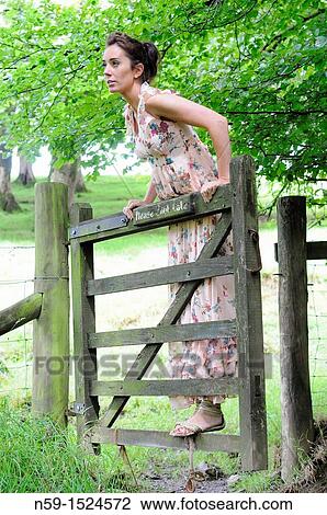 Woman in rural setting View Large Photo Image Stock Image - Woman in rural setting. Fotosearch