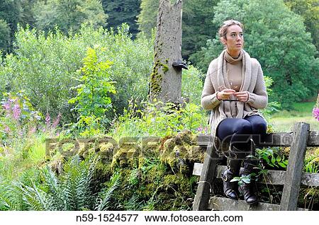 Woman in rural setting View Large Photo Image Stock Photo - Woman in rural setting. Fotosearch