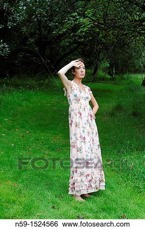 Woman in rural setting View Large Photo Image Stock Photograph - Woman in rural setting. Fotosearch