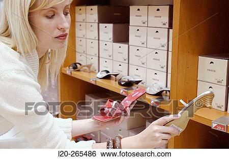 Woman in shoe store View Large Photo Image Stock Photograph - Woman in shoe store. Fotosearch