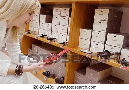 Woman in shoe store View Large Photo Image Stock Photography - Woman in shoe store. Fotosearch