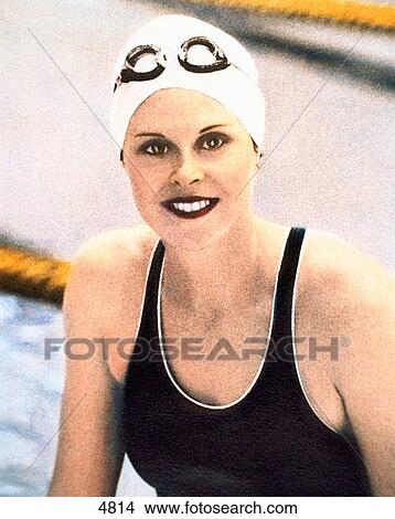Woman in swimming suit and cap View Large Photo Image Picture - Woman in swimming suit and cap. Fotosearch