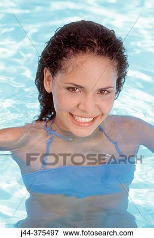Woman in the pool smiling View Large Photo Image Stock Photo - Woman in the pool smiling. Fotosearch