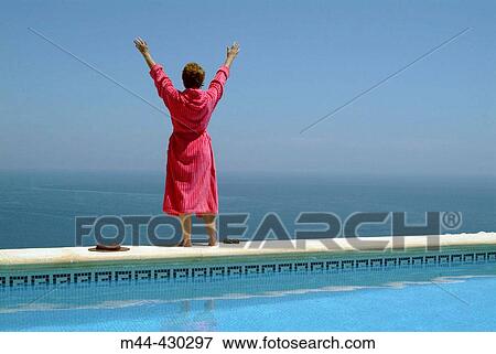 Stock Photo - Woman in the swimming-pool. Javea. Alicante. Spain.. Fotosearch