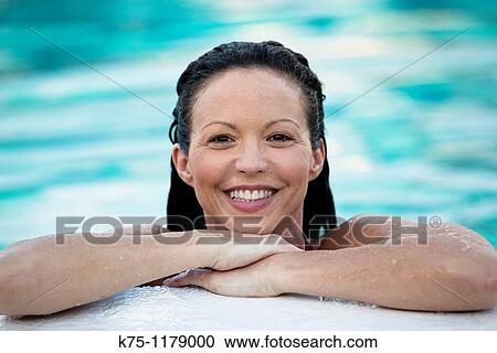 Woman in the water at edge of pool View Large Photo Image Stock Image - Woman in the water at edge of pool. Fotosearch