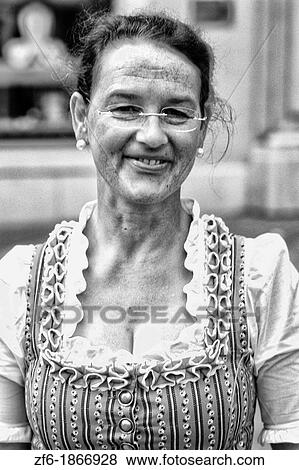 Woman in traditional costume scene in Old Town Salzburg Austria View Large Photo Image Stock Photo - Woman in traditional costume scene in Old Town Salzburg Austria. Fotosearch