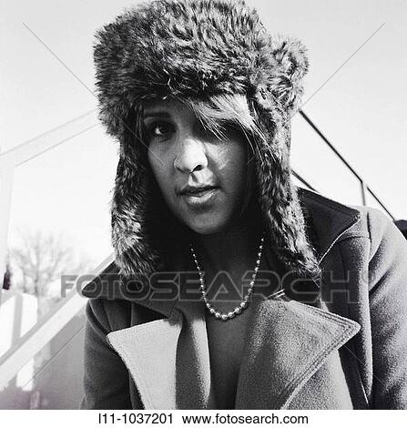 Woman in ushanka, looking into lens View Large Photo Image Stock Image - Woman in ushanka, looking into lens. Fotosearch