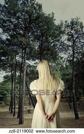 Woman in vitange dress walking in the forest. View Large Photo Image Stock Image - Woman in vitange dress walking in the forest.. Fotosearch