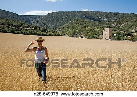 Stock Photo - Woman in wheat field. Valdenoceda. Burgos province, Spain. Fotosearch