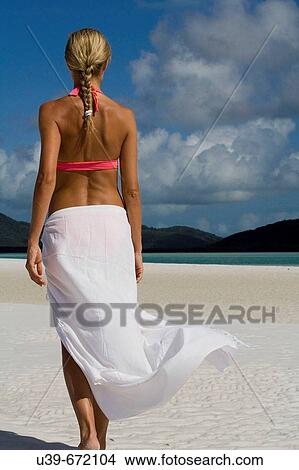 Woman in white sarong on Whitehaven Beach, Australia. View Large Photo Image Picture - Woman in white sarong on Whitehaven Beach, Australia.. Fotosearch