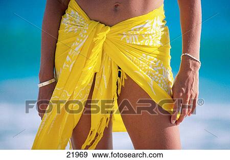 Woman in yellow sarong View Large Photo Image Stock Photo - Woman in yellow sarong. Fotosearch
