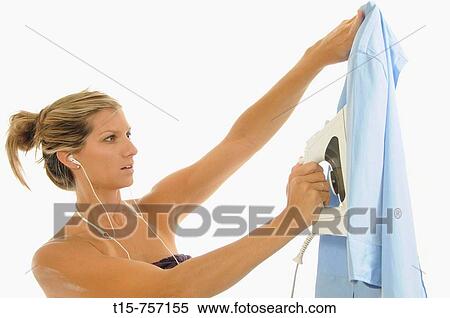 woman ironing a shirt View Large Photo Image Stock Photography - woman ironing a shirt. Fotosearch