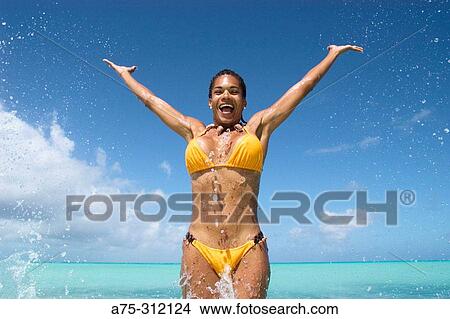 woman jumping in the sea View Large Photo Image Picture - woman jumping in the sea. Fotosearch