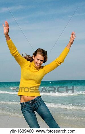 woman jumping next to seaside View Large Photo Image Stock Image - woman jumping next to seaside. Fotosearch