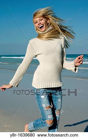 woman jumping next to seaside View Large Photo Image Stock Image - woman jumping next to seaside. Fotosearch
