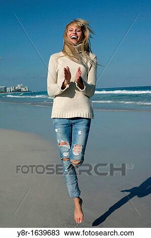 woman jumping next to seaside View Large Photo Image Stock Image - woman jumping next to seaside. Fotosearch