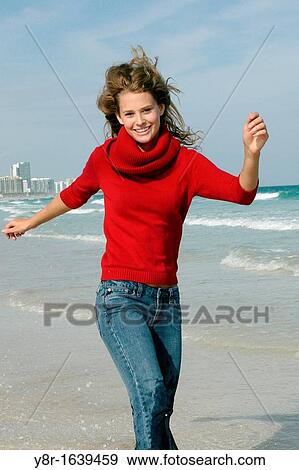 woman jumping next to seaside View Large Photo Image Stock Photo - woman jumping next to seaside. Fotosearch
