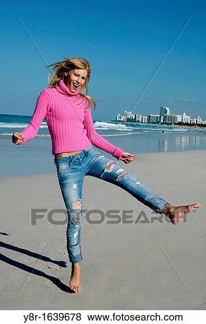 woman jumping next to seaside View Large Photo Image Stock Photo - woman jumping next to seaside. Fotosearch