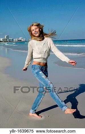 woman jumping next to seaside View Large Photo Image Stock Photography - woman jumping next to seaside. Fotosearch