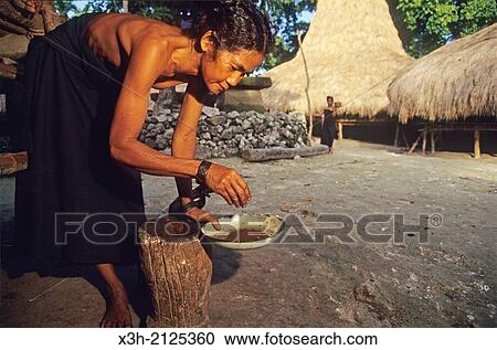 woman just grinding coffea at Waikabubak, Sumba island, Lesser Sunda Islands, Republic of Indonesia, Southeast Asia and Oceania. View Large Photo Image Stock Image - woman just grinding coffea at Waikabubak, Sumba island, Lesser Sunda Islands, Republic of Indonesia, Southeast Asia and Oceania.. Fotosearch