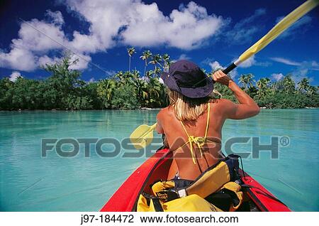 Woman kayaking in lagoon. Aitutaki. Cook Islands View Large Photo Image Stock Image - Woman kayaking in lagoon. Aitutaki. Cook Islands. Fotosearch