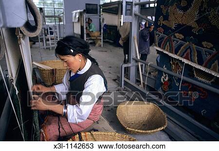 Woman kniting carpets Shigatse Tibet View Large Photo Image Stock Image - Woman kniting carpets Shigatse Tibet. Fotosearch
