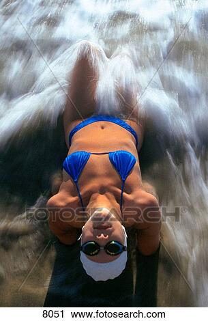 Woman laying in surf View Large Photo Image Stock Image - Woman laying in surf. Fotosearch