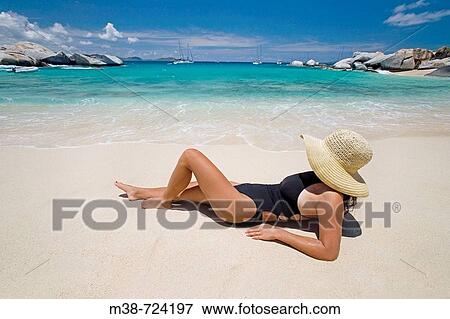 Woman laying on beach, The Baths, Virgin Gorda, British Virgin Islands View Large Photo Image Stock Photo - Woman laying on beach, The Baths, Virgin Gorda, British Virgin Islands. Fotosearch
